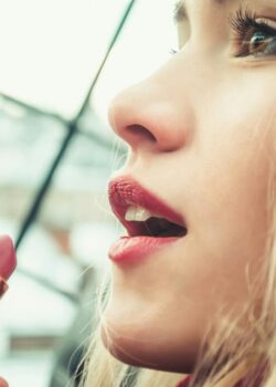 selective-focus-photography-of-woman-holding-lipstick-F4AMM1293ag