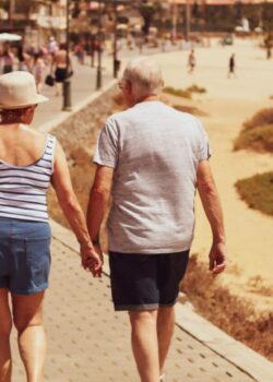 man-and-woman-walking-on-road-while-holding-hands-DLLpNmIG0pk