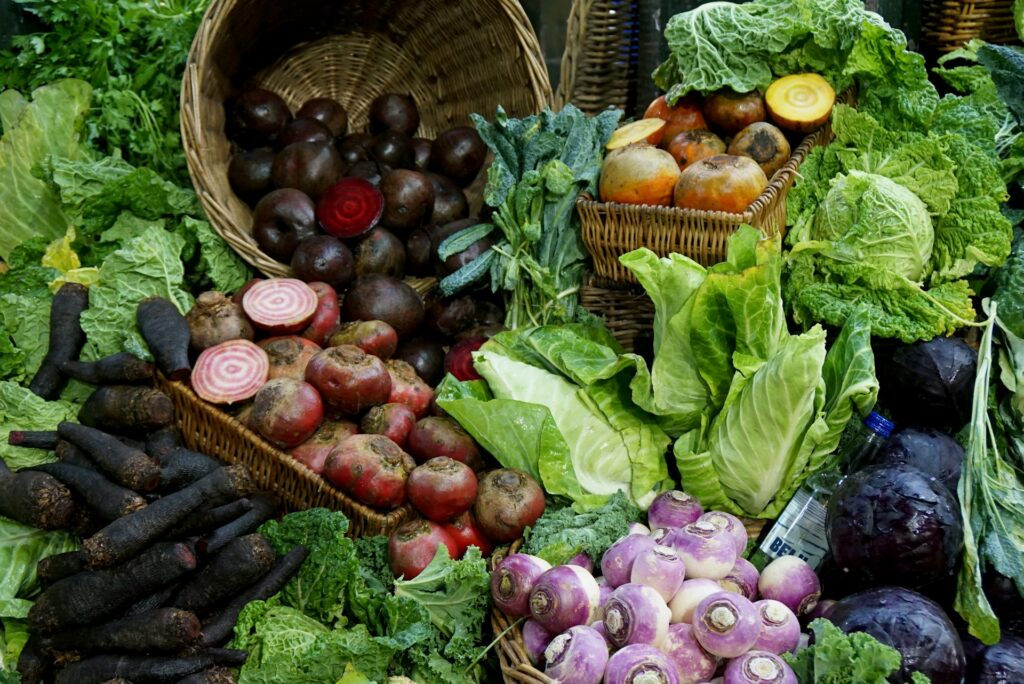 green-and-red-vegetable-on-brown-woven-basket-vO1h-ZUlSKM