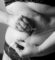 grayscale-photo-of-woman-holding-her-breast-Fu7RNjl-pW0