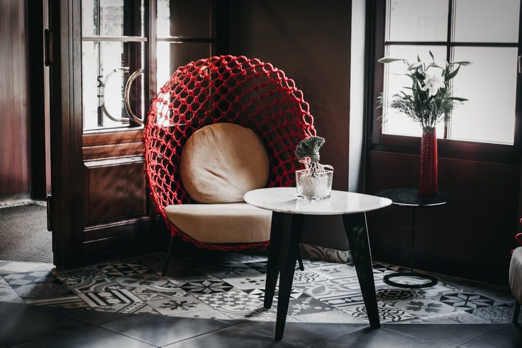 rendy-chair-and-table-decorated-with-green-plants-in-modern-cafe-5894585/