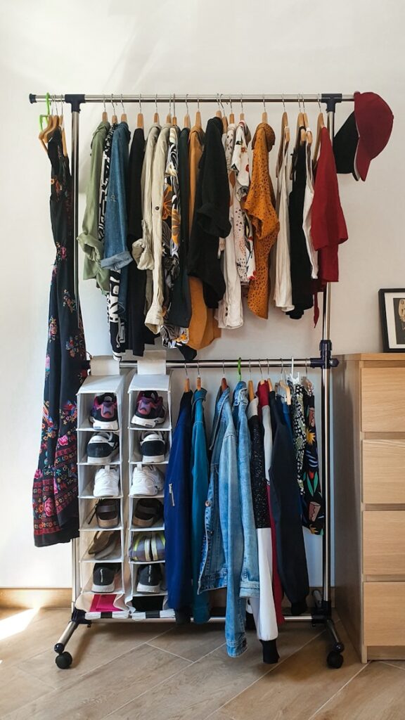 clothes-hanged-on-brown-wooden-cabinet-q7q-dMzWnaA