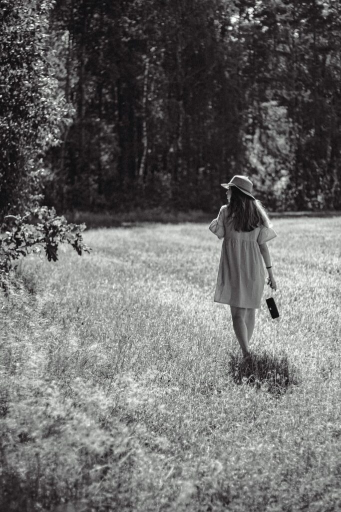 woman-walking-on-a-field-in-summer-13560835/