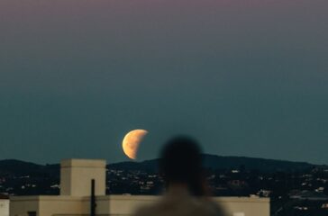 person-standing-during-nighttime-with-crescent-moon-PZXq_fY2hyI