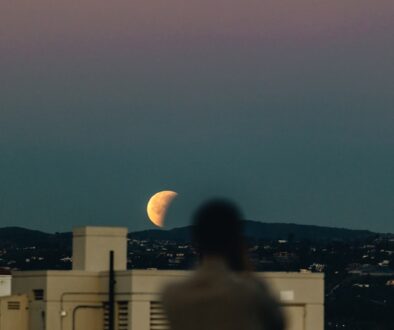 person-standing-during-nighttime-with-crescent-moon-PZXq_fY2hyI